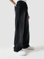 Fade washed trouser female model seated lifestyle shot Pakistan – GROOVY