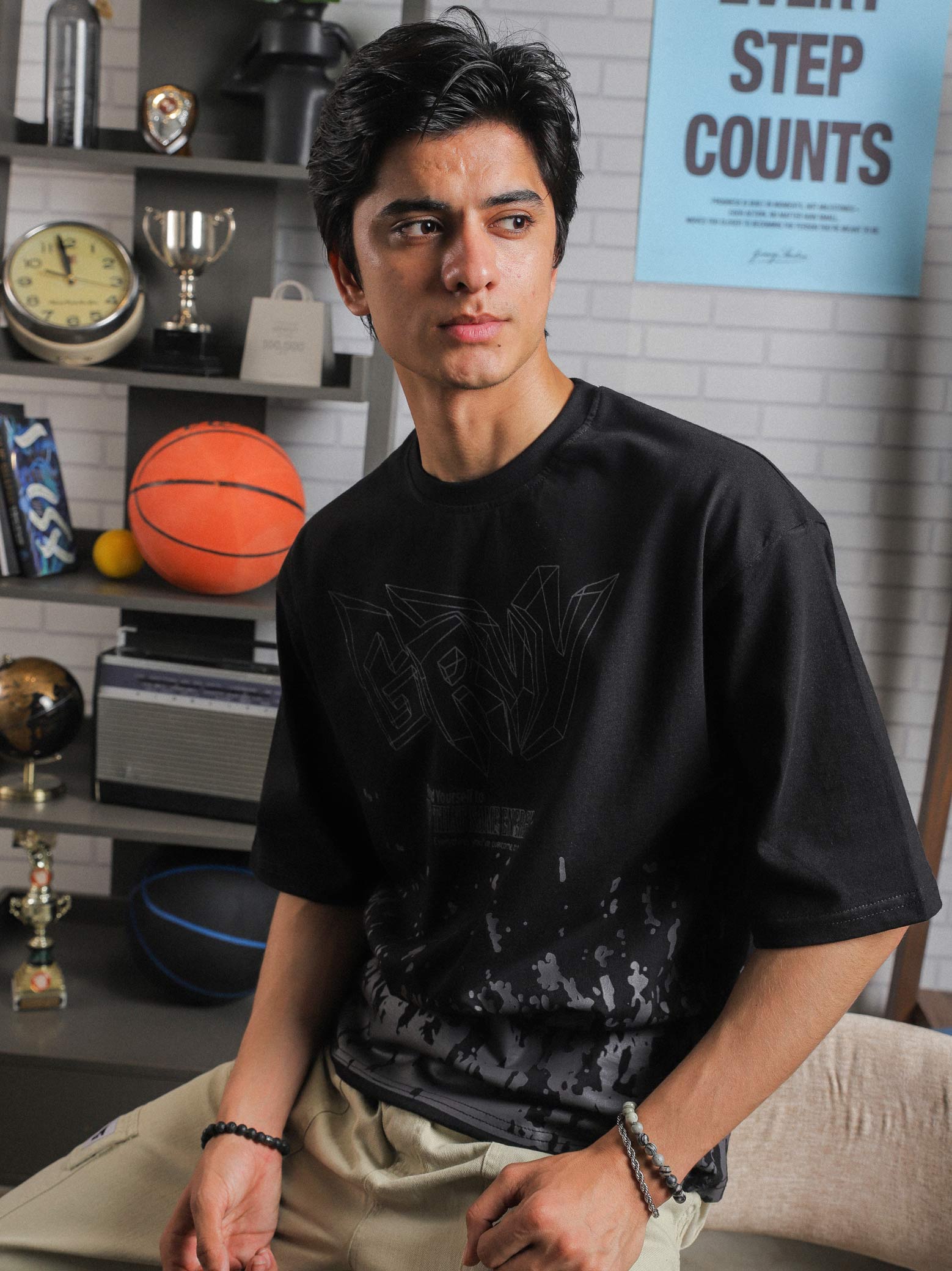 Close-up of GRVY front graphic and motivational quote “Keep That Same Energy” on black heavy-weight streetwear t-shirt.