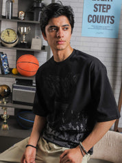 Close-up of GRVY front graphic and motivational quote “Keep That Same Energy” on black heavy-weight streetwear t-shirt.