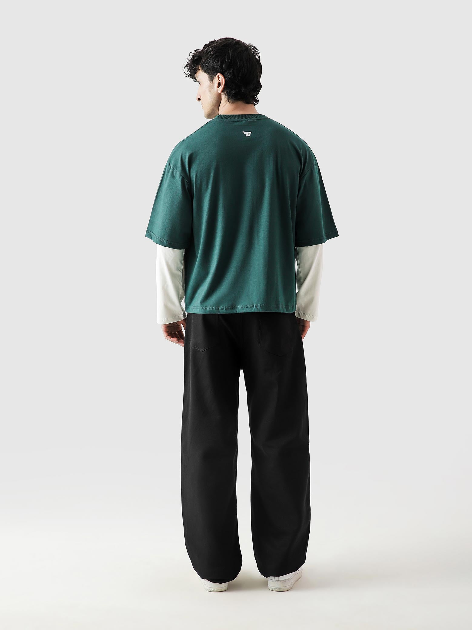 96 Double Layer Jersey racing green male model seated lifestyle Pakistan – GROOVY