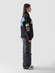 Racer jacket male model seated half body lifestyle shot Pakistan – GROOVY