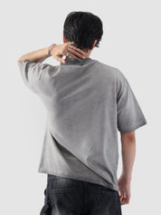 Rear view of the Oil Fade Blank t-shirt showcasing its clean silhouette and seamless gradient fade from stone grey to charcoal.
