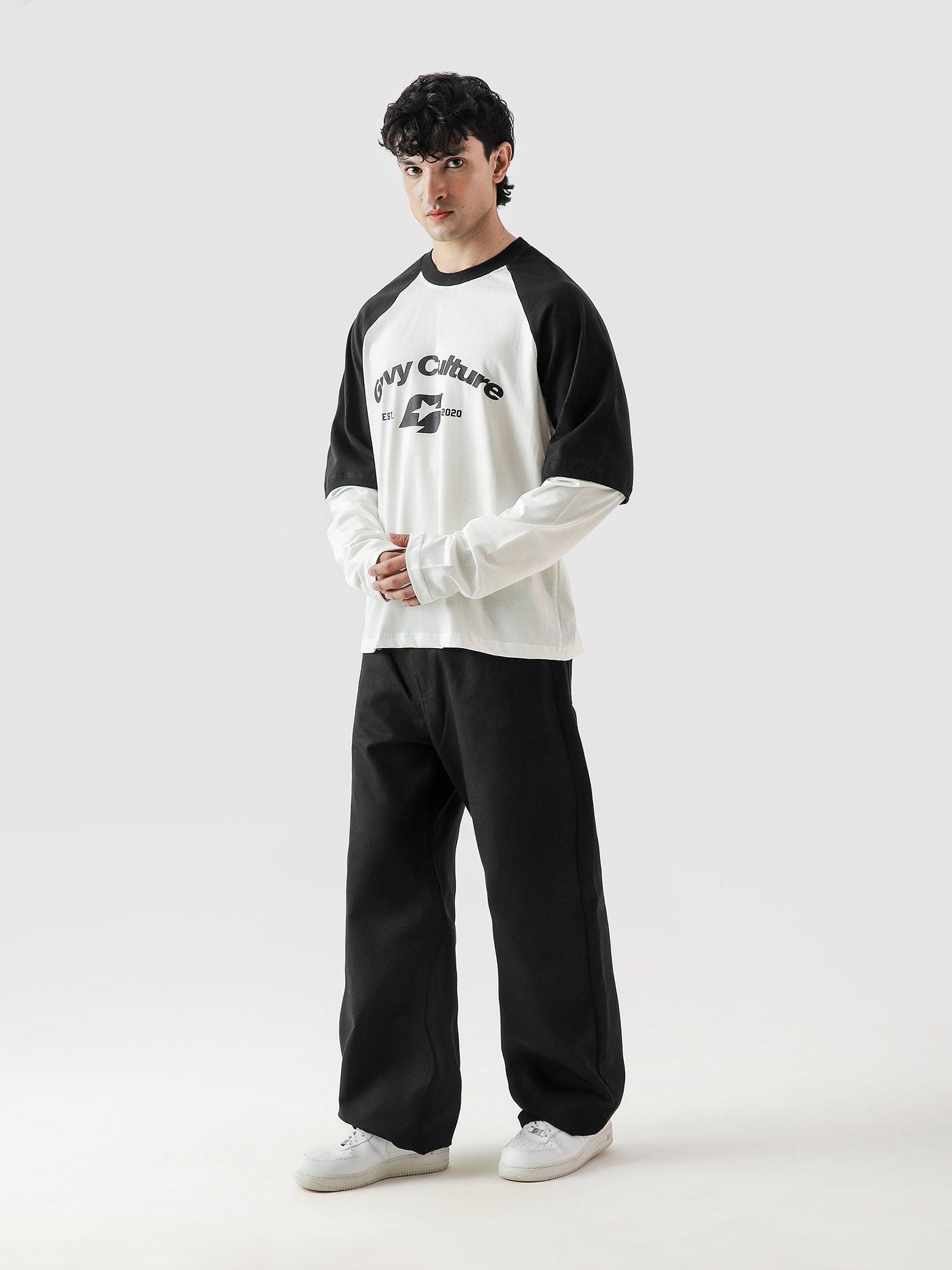 ROLLER TEE male model seated half body lifestyle shot Pakistan – GROOVY