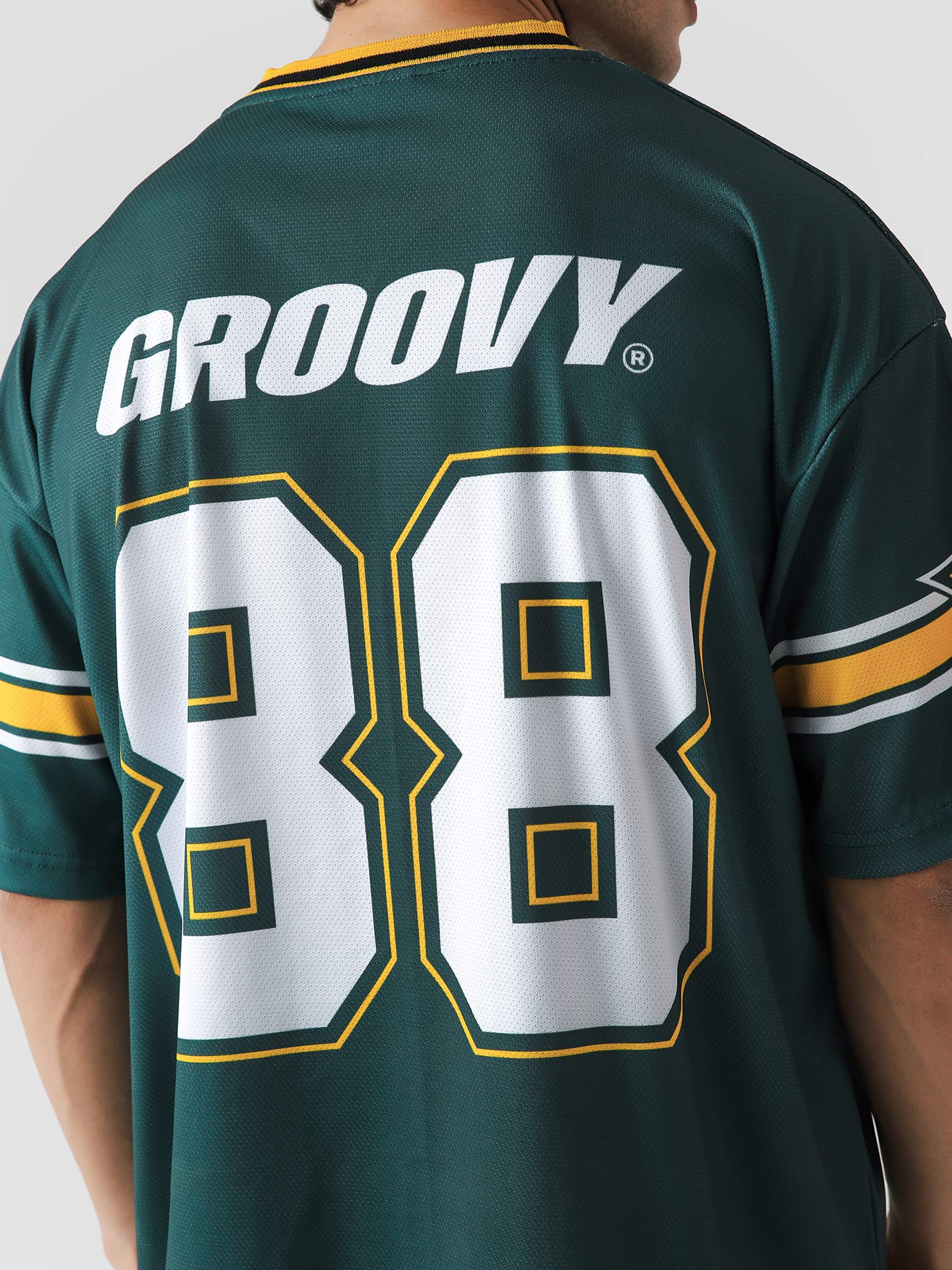 88 Athletics basketball jersey flat lay racing green gold oversized Pakistan – GROOVY