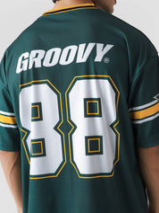 88 Athletics basketball jersey flat lay racing green gold oversized Pakistan – GROOVY