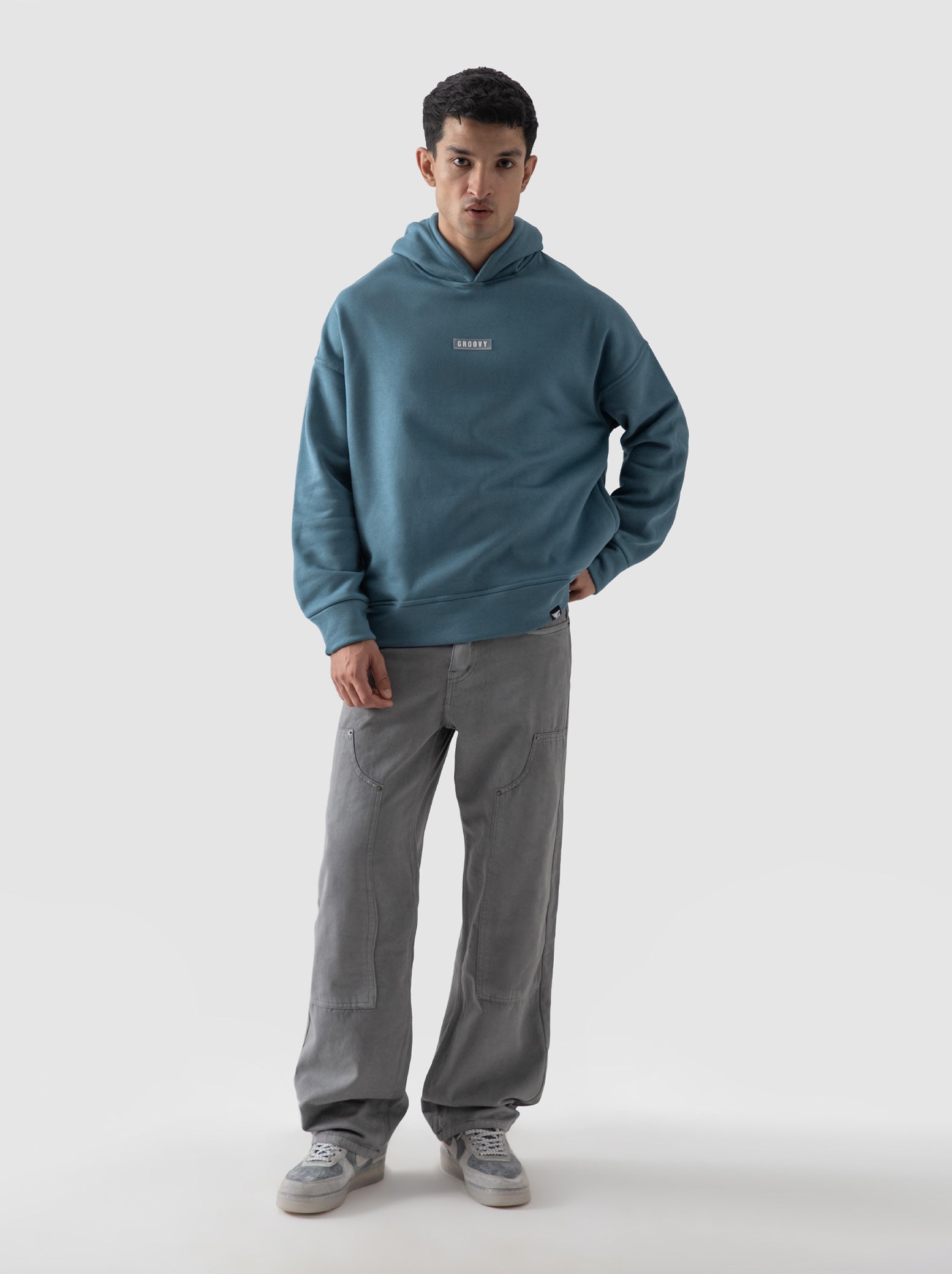 Teal blue oversized hoodie male model full body front view Pakistan – GROOVY