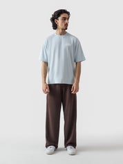 Heart Ashtray frost blue tee male model seated lifestyle Pakistan – GROOVY
