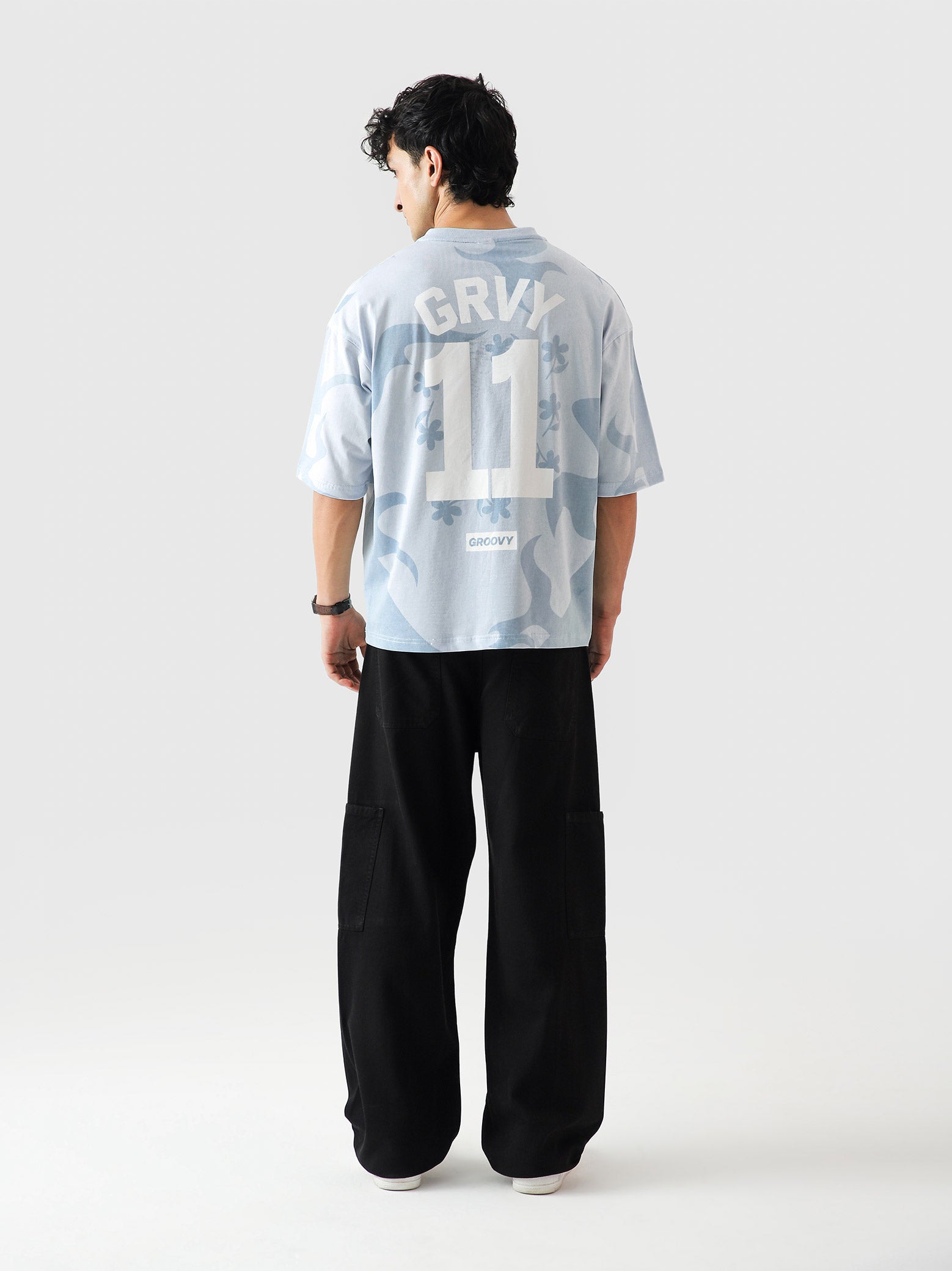 Allover GRVY frost blue tee male model full body front view allover print Pakistan – GROOVY