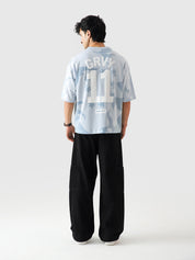 Allover GRVY frost blue tee male model full body front view allover print Pakistan – GROOVY