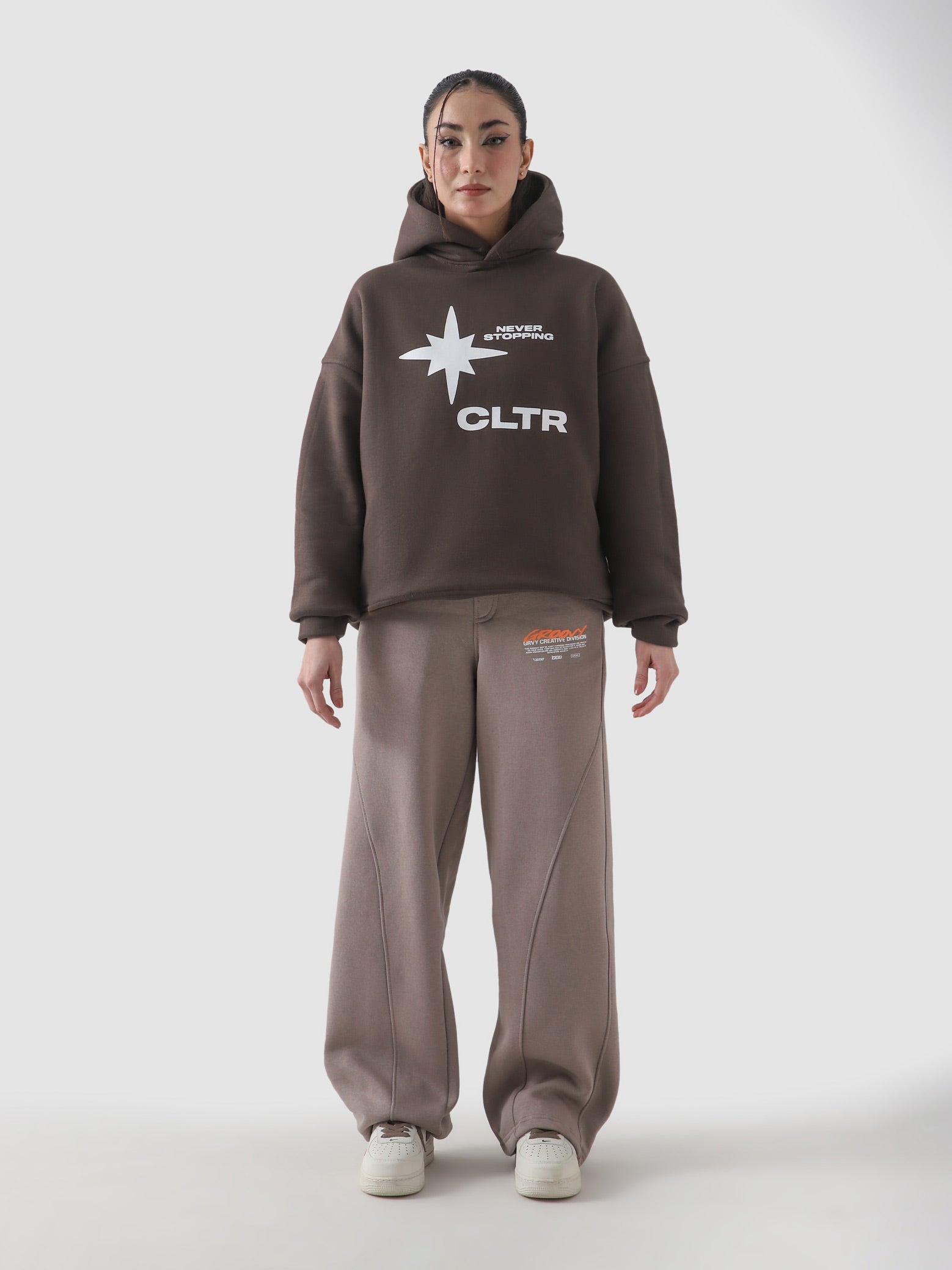 Never Stopping Culture chocolate brown hoodie male model full body front Pakistan – GROOVY
