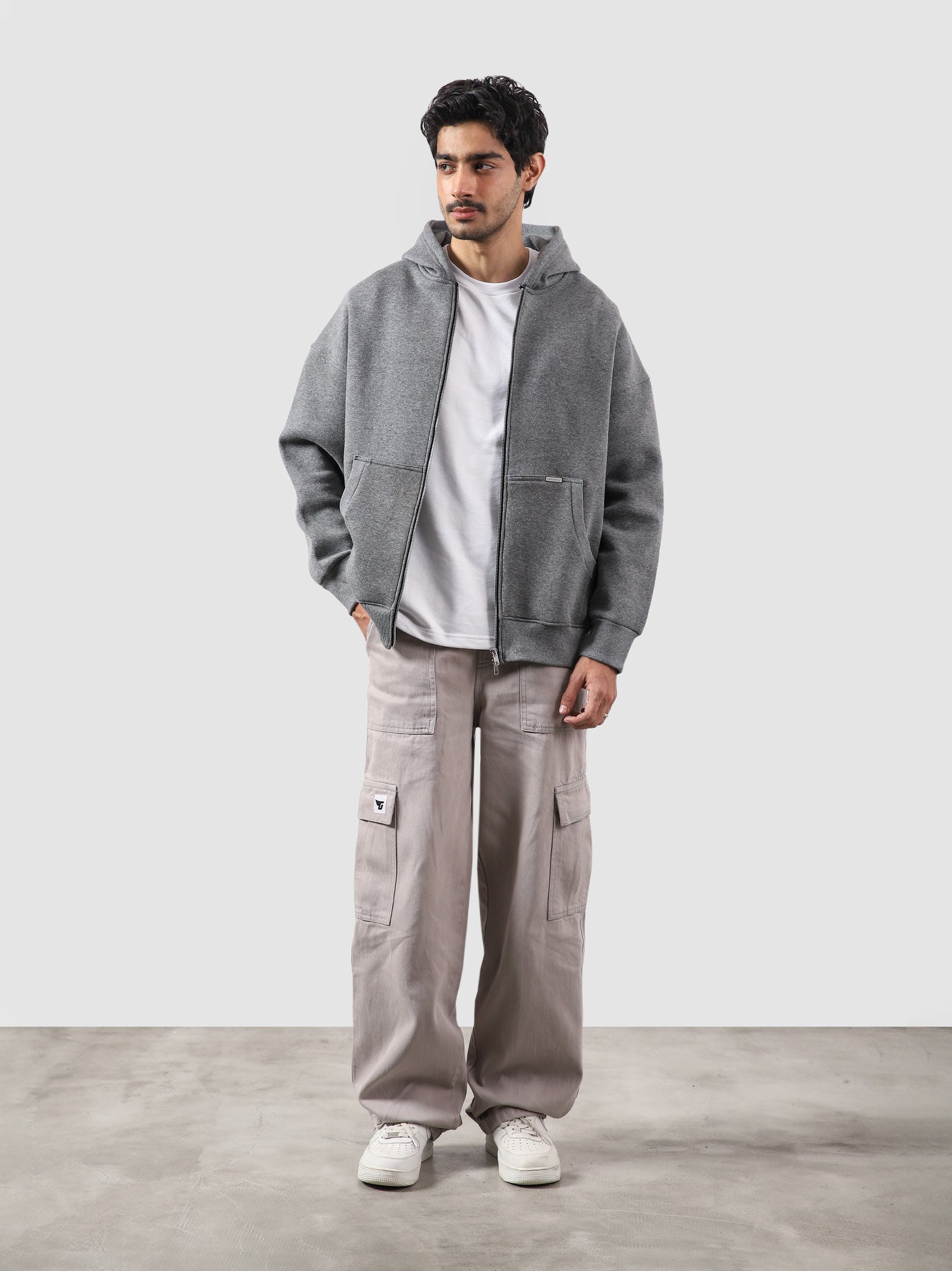 Dark heather grey essential zipper hoodie male model full body front view Pakistan – GROOVY