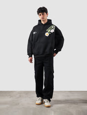 Floral hoodie male model full body front view bold floral graphic Pakistan – GROOVY