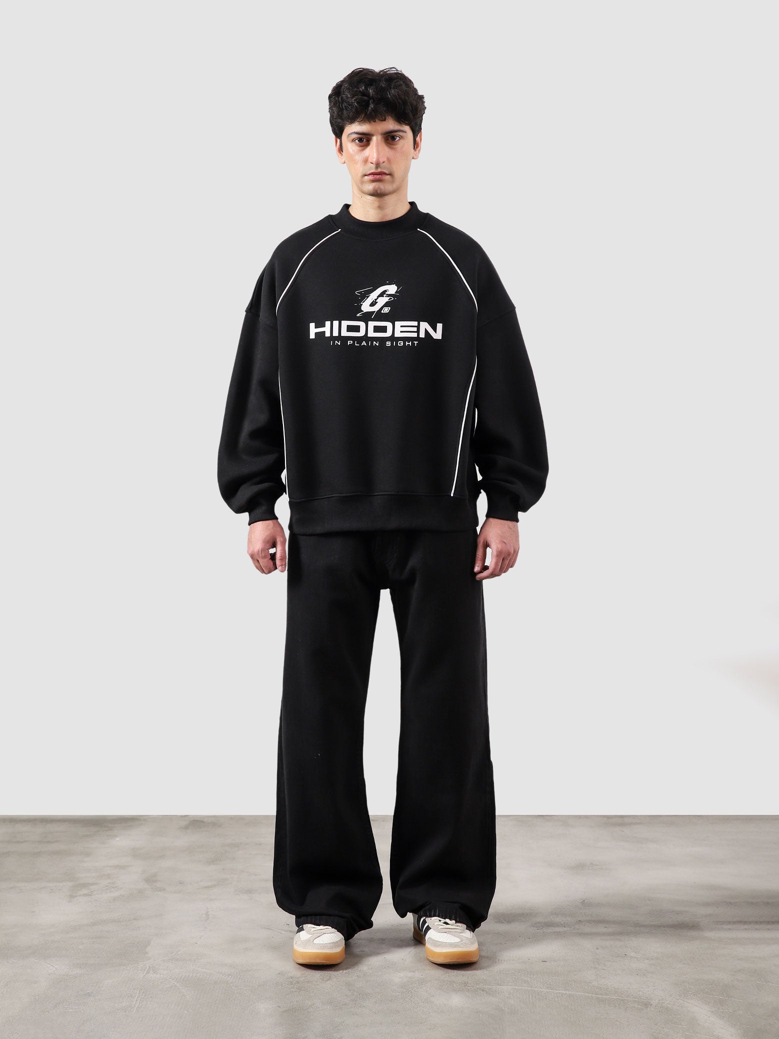 Hidden In Plain Sight black oversized sweatshirt male model full body front view Pakistan – GROOVY