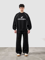 Hidden In Plain Sight black oversized sweatshirt male model full body front view Pakistan – GROOVY