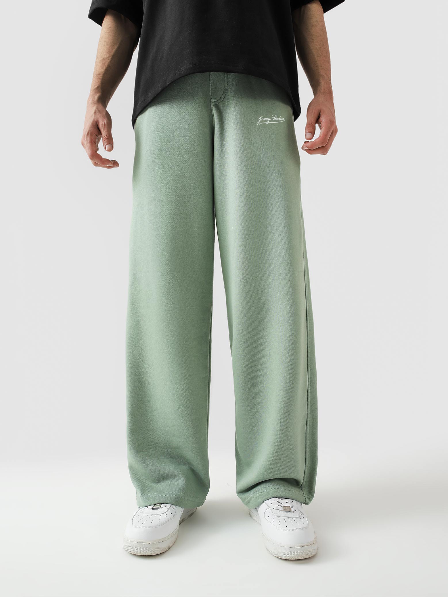 Sage green baggy trousers male model full body front view Pakistan – GROOVY