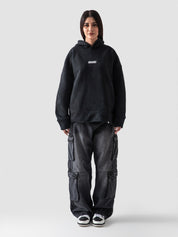Washed black oversized hoodie male model full body front view Pakistan – GROOVY