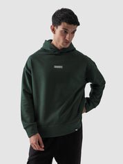 Dark green oversized hoodie male model full body front view Pakistan – GROOVY