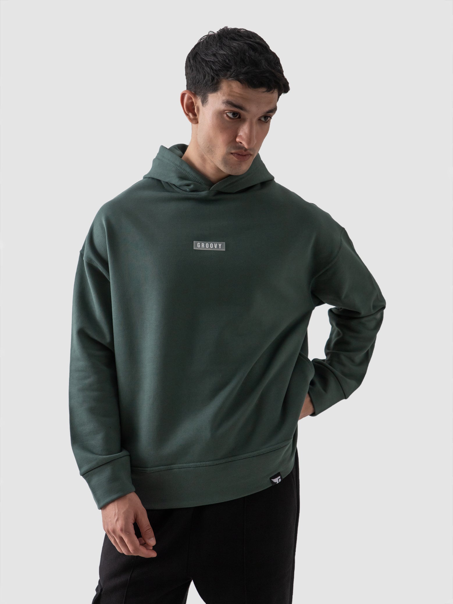 Hunter green oversized hoodie male model full body front view Pakistan – GROOVY