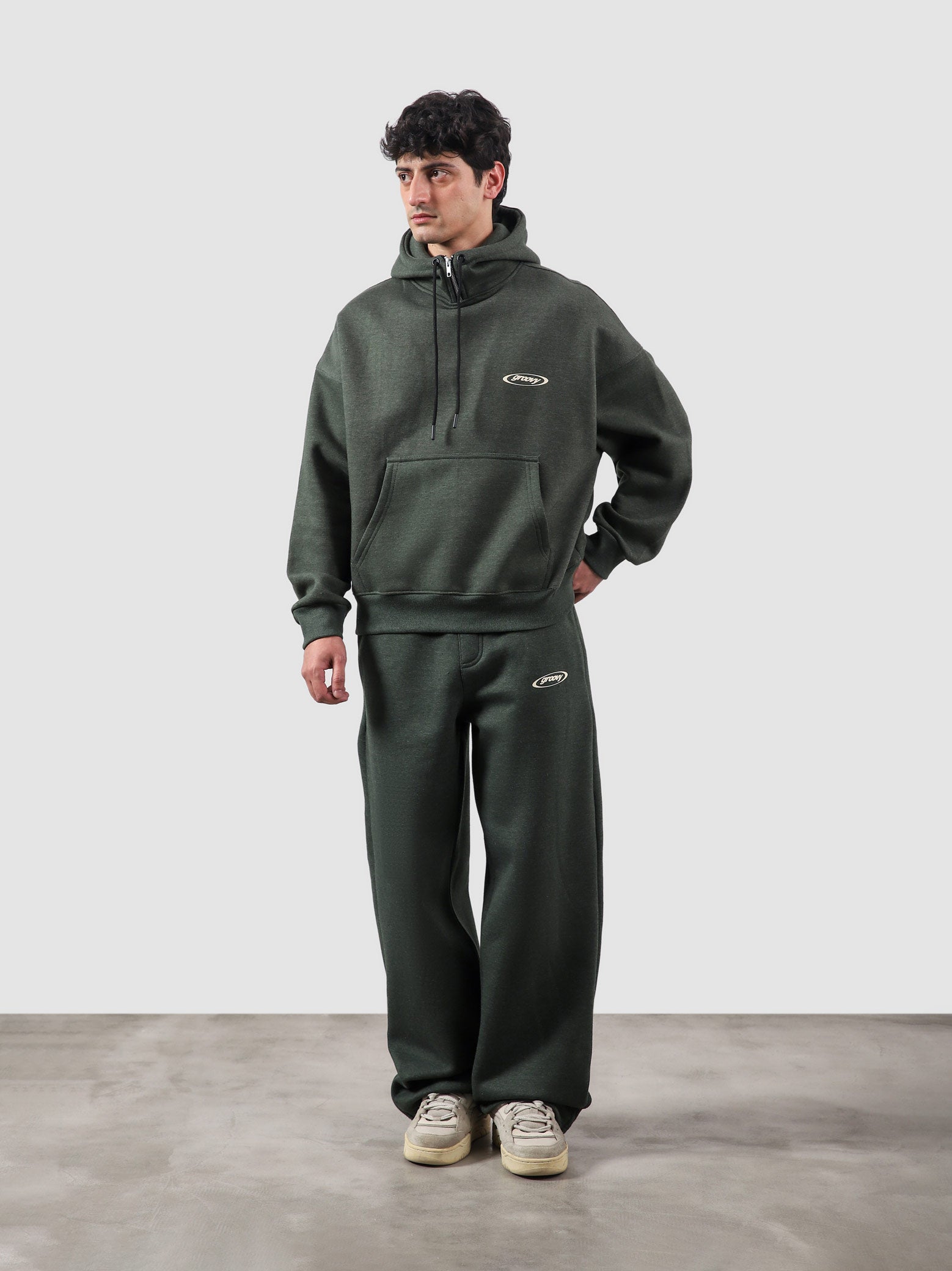 Utility Top heather green male model full body front view oversized hoodie Pakistan – GROOVY