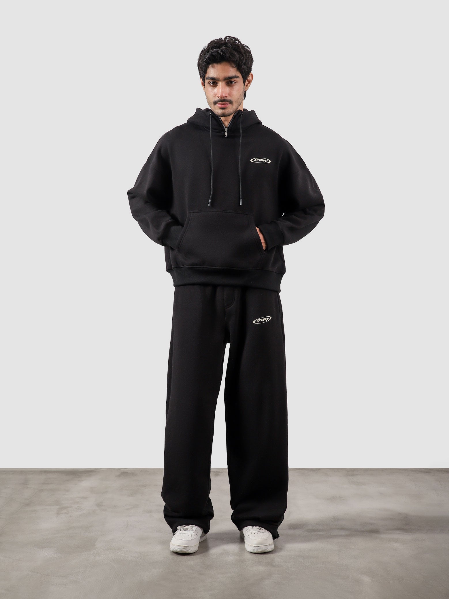 Utility Top black male model full body front view oversized hoodie Pakistan – GROOVY