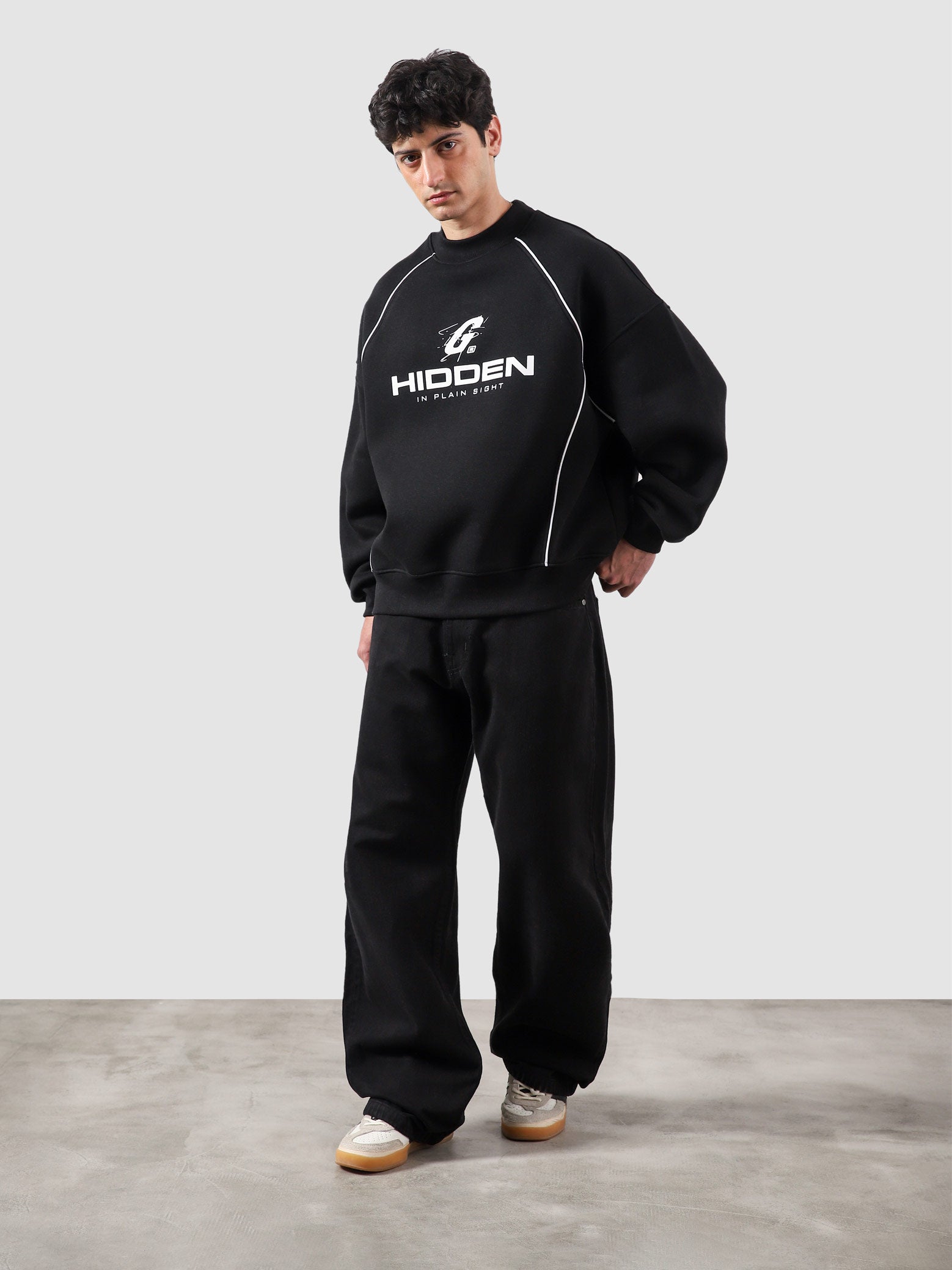 Hidden In Plain Sight black sweatshirt male model back view subtle detail Pakistan – GROOVY