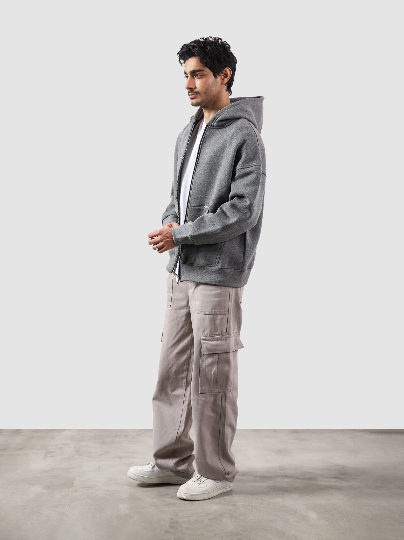 Dark heather grey essential zipper hoodie male model back view relaxed fit Pakistan – GROOVY