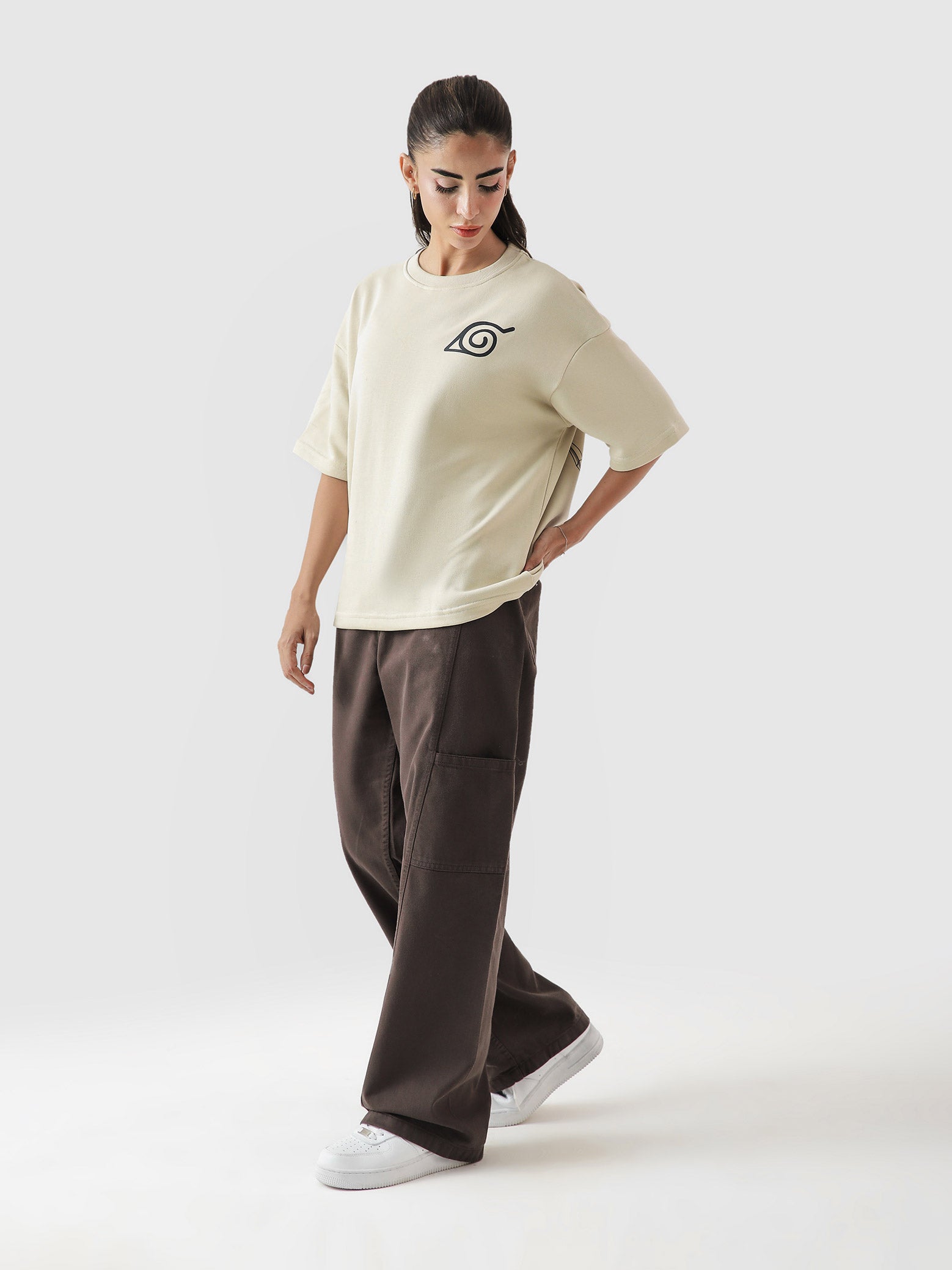 Naruto Uzumaki beige oversized tee male model full body front view Hidden Leaf Pakistan – GROOVY