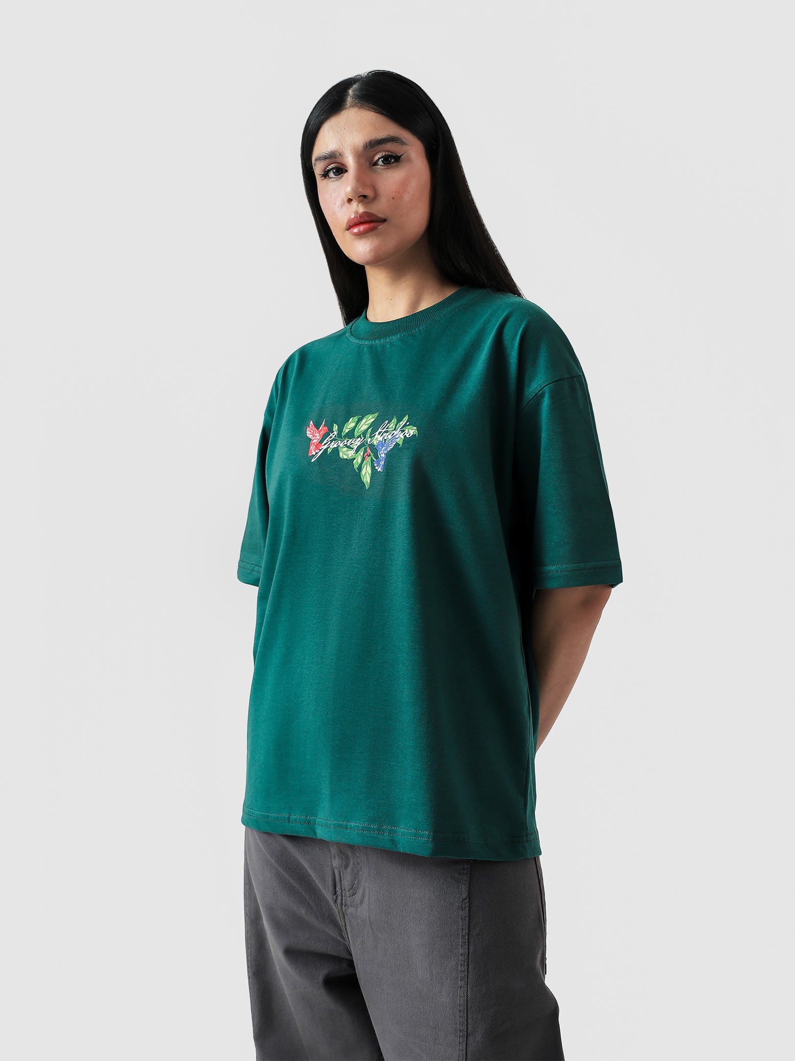 Green Hummingbird tee female model back view Pakistan – GROOVY