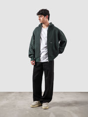 Racing green essential zipper hoodie male model back view relaxed fit Pakistan – GROOVY