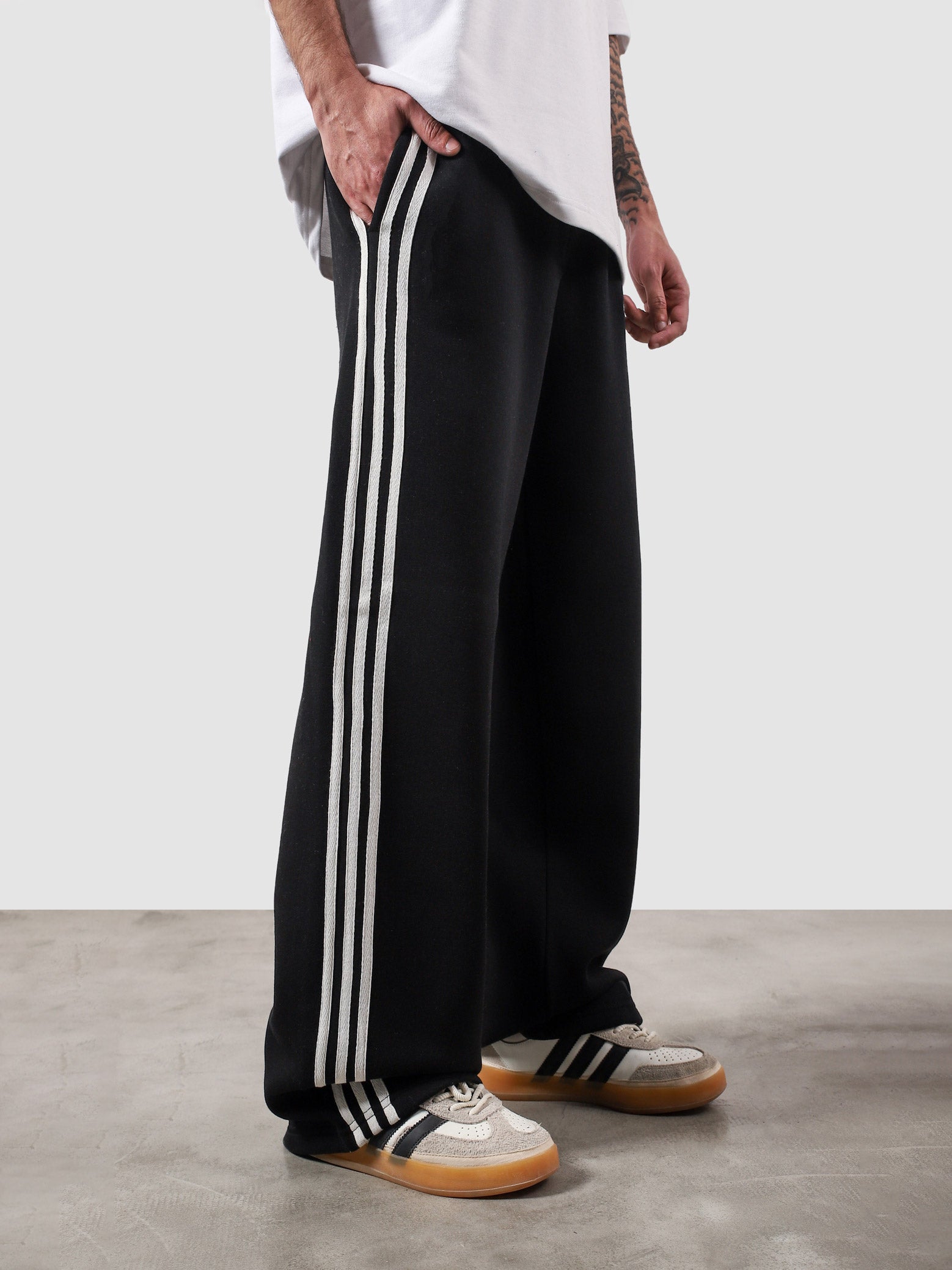 Heritage Pants black summer male model back view striped sides relaxed fit Pakistan – GROOVY
