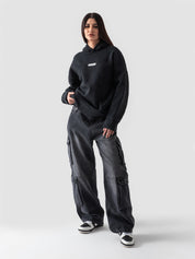 Washed black hoodie male model back view 340 GSM cotton Pakistan – GROOVY