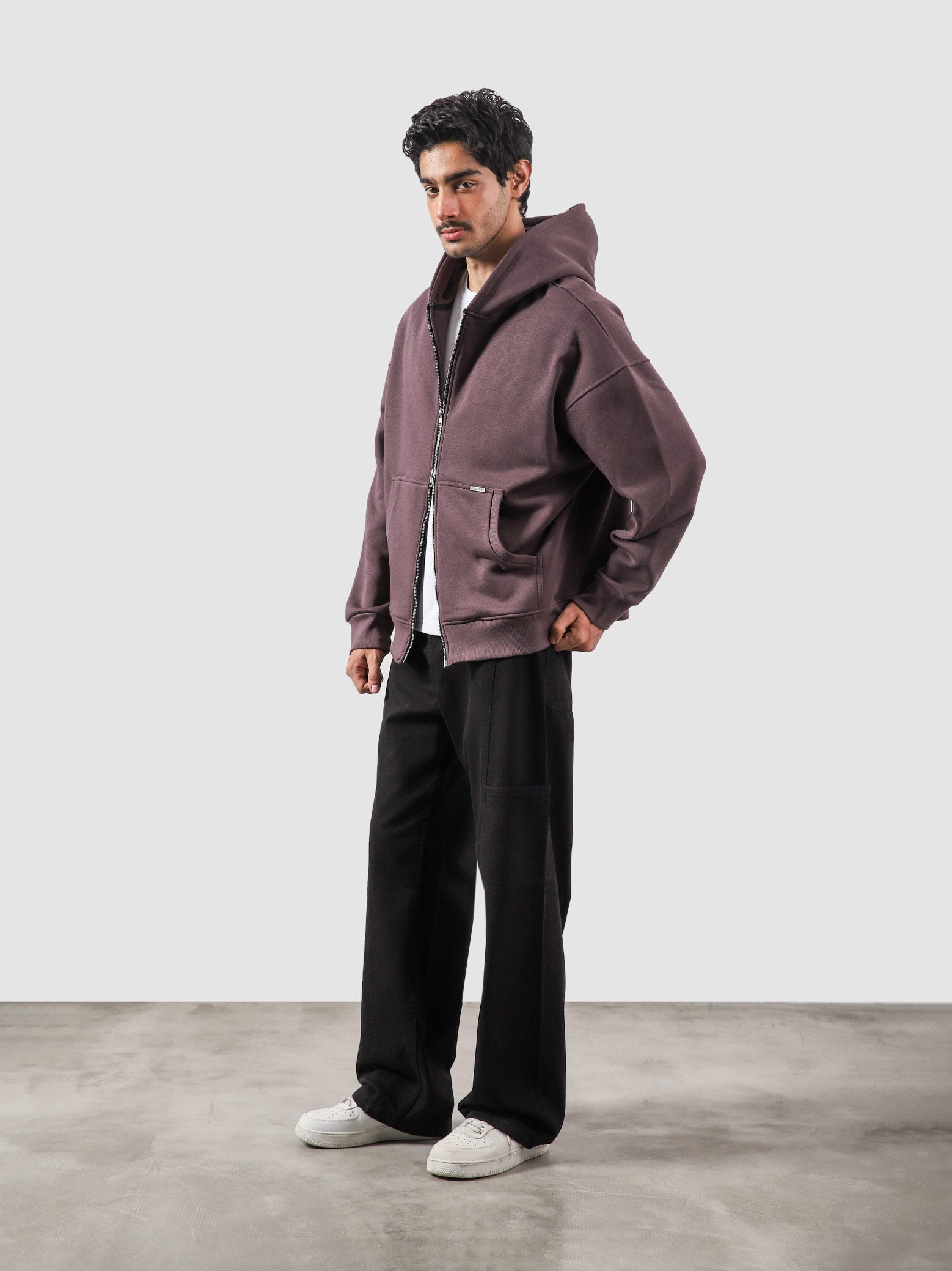 Plum essential zipper hoodie male model back view relaxed fit Pakistan – GROOVY