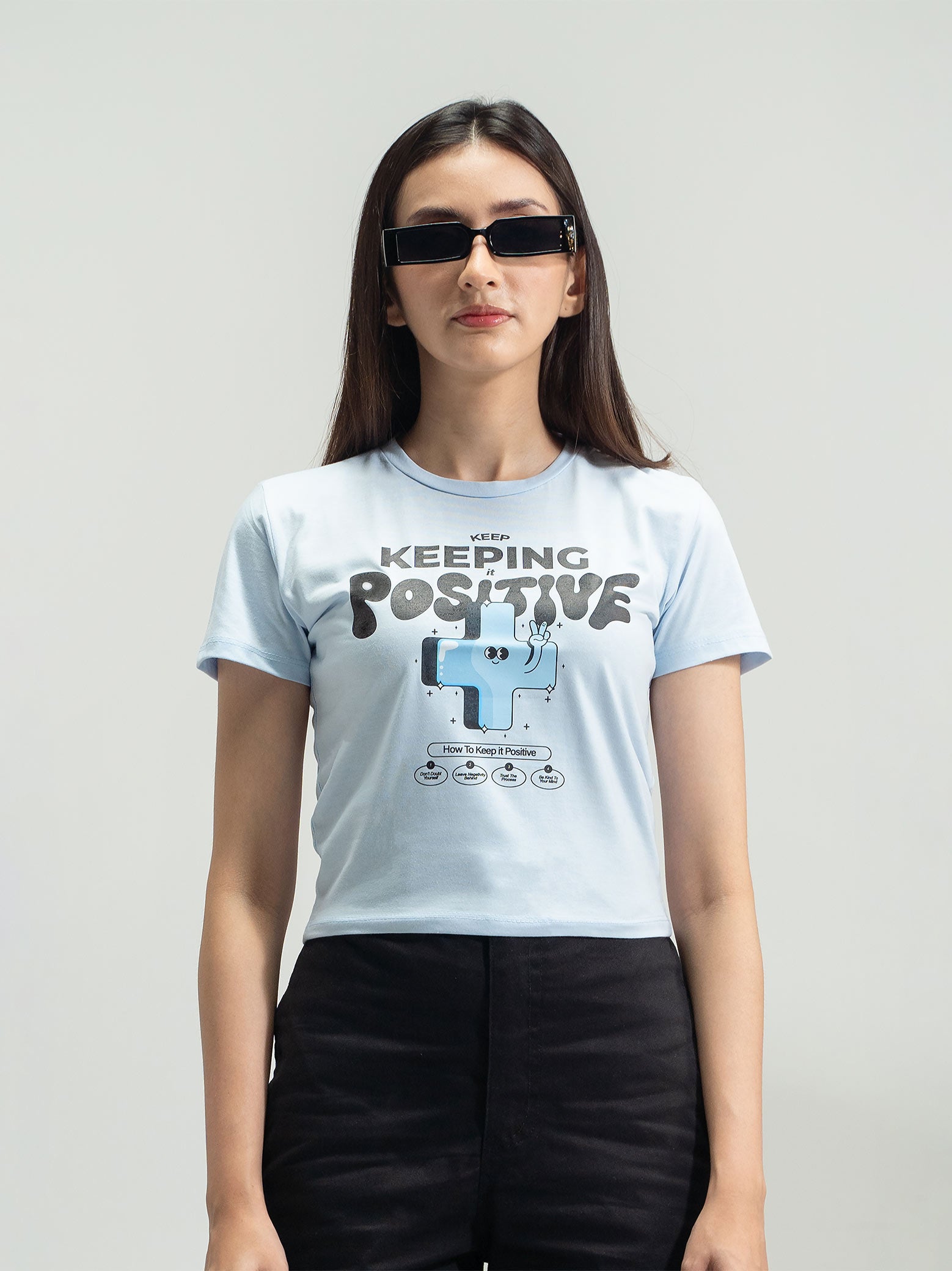 Ice Blue Baby Tee Female Model Back View – Keep Keeping It Positive – GROOVY Pakistan