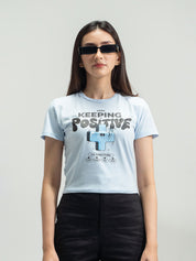 Ice Blue Baby Tee Female Model Back View – Keep Keeping It Positive – GROOVY Pakistan
