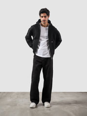 Black essential zipper hoodie male model back view relaxed fit Pakistan – GROOVY