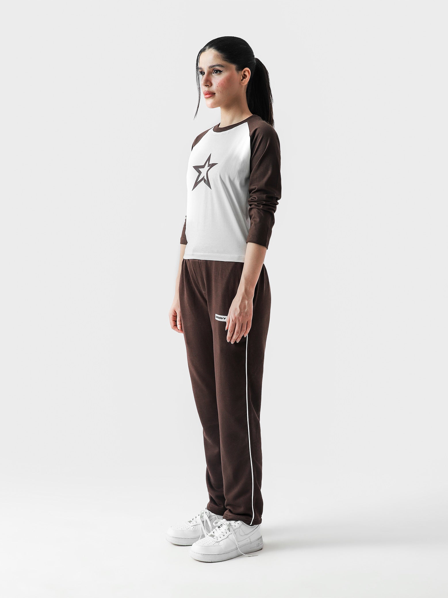 Y2K Star baby tee female model back view star graphic Pakistan – GROOVY