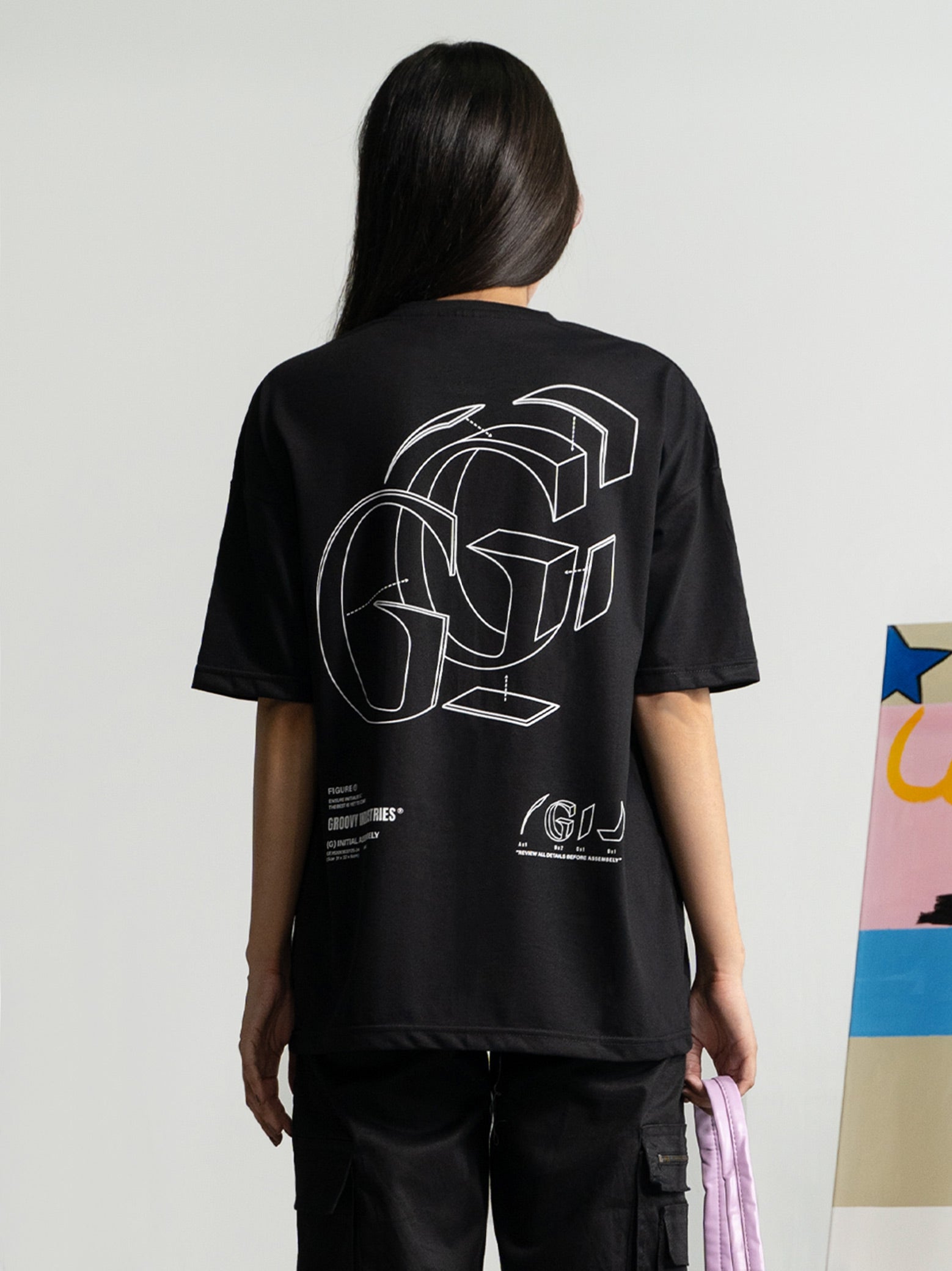 Initial Assembly tee male model back view bold G logo graphic oversized Pakistan – GROOVY