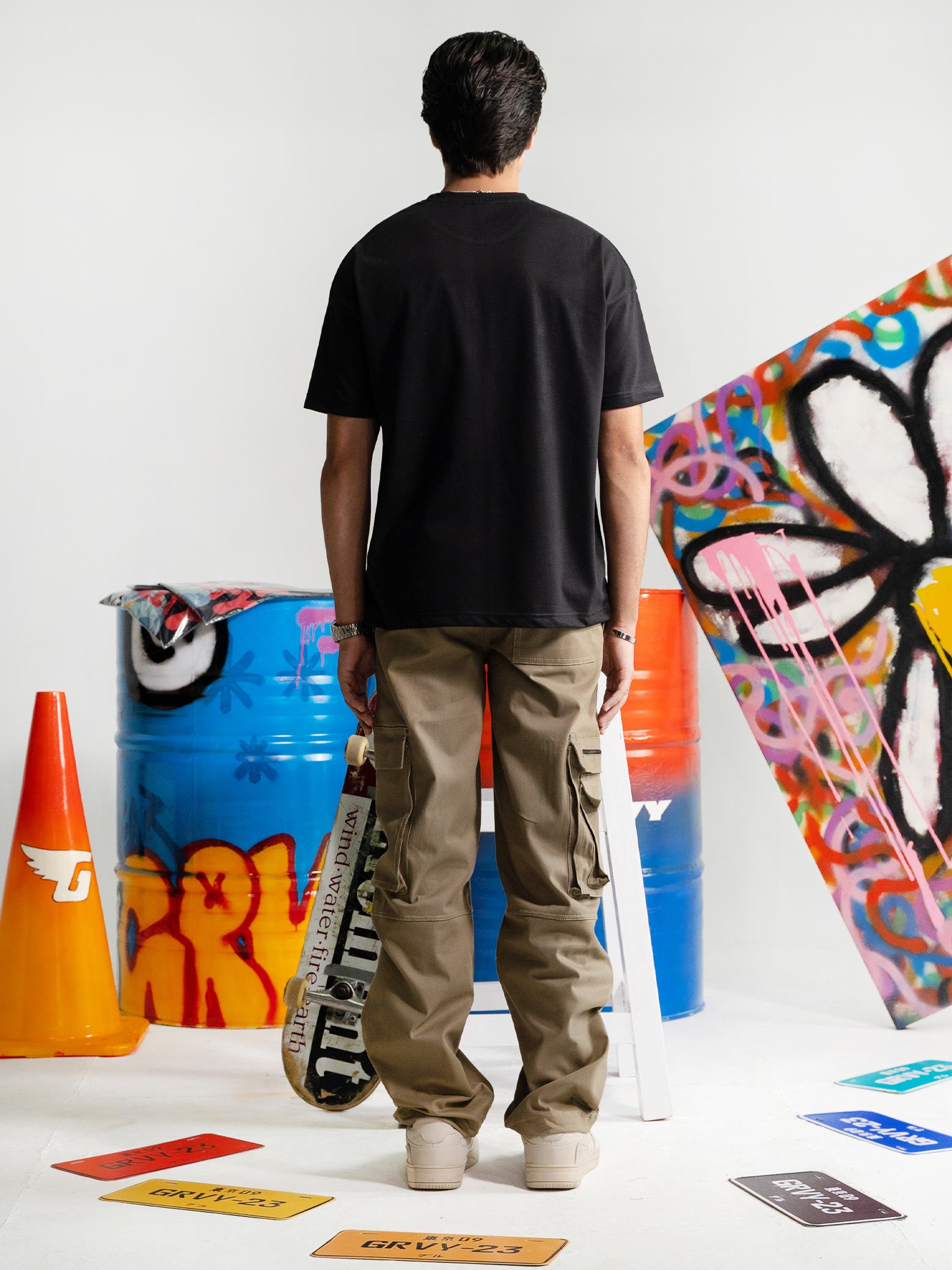 Black Oversized Tee Male Model Back View – Dropout – GROOVY Pakistan