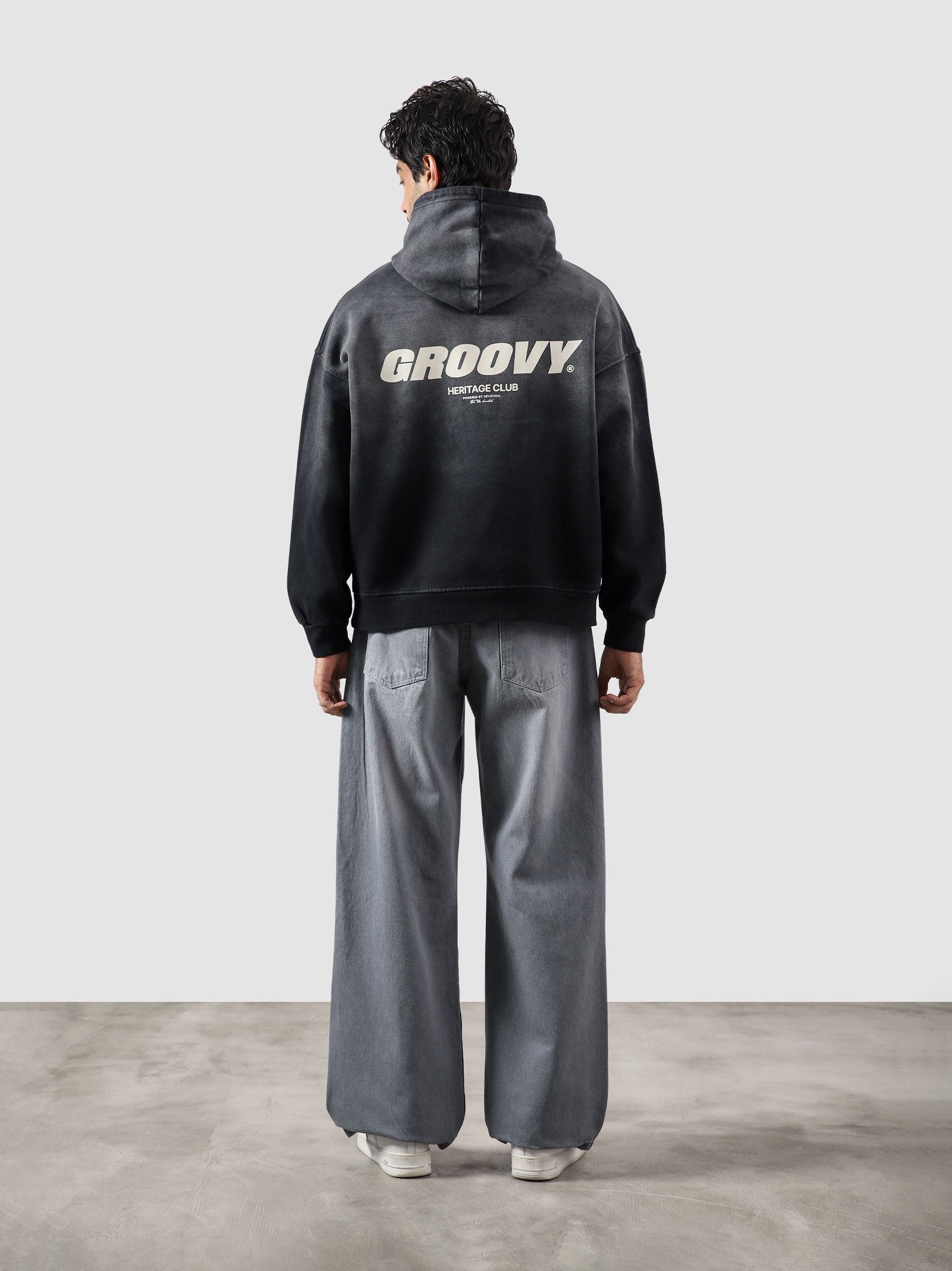 Fade washed hoodie male model side view full body vintage wash streetwear Pakistan – GROOVY