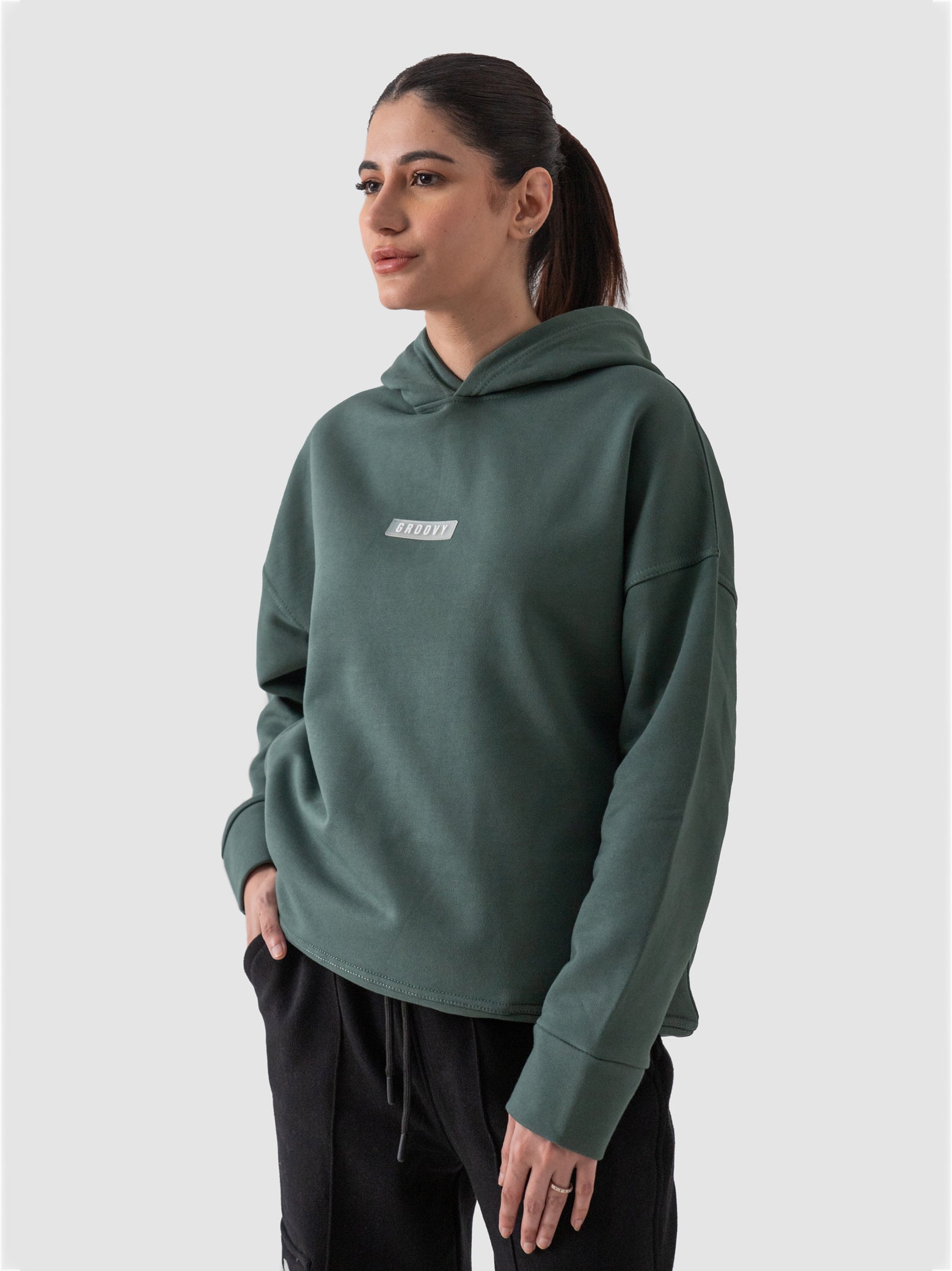 Hunter green oversized hoodie male model side view full body Pakistan – GROOVY