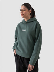 Hunter green oversized hoodie male model side view full body Pakistan – GROOVY