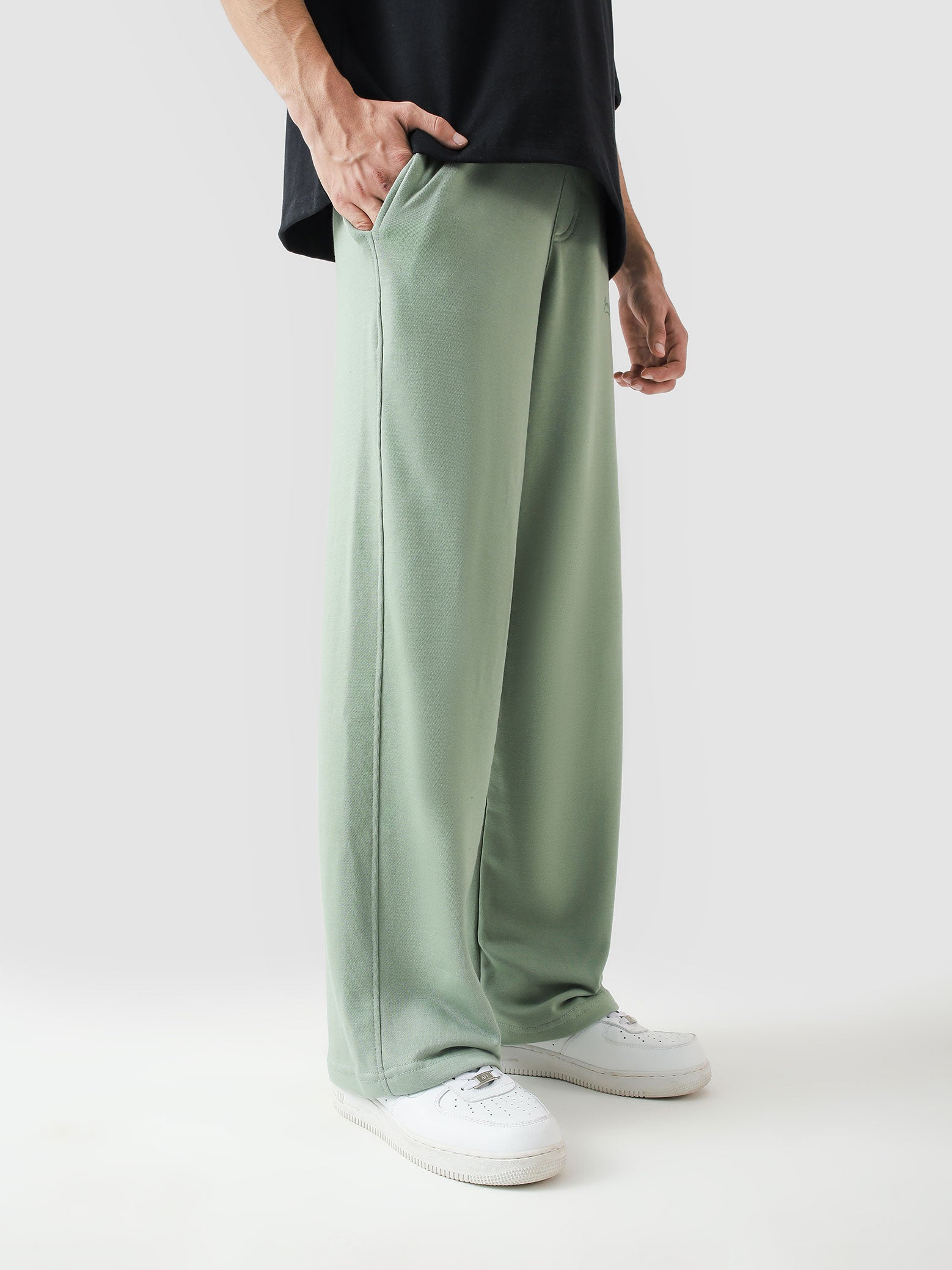 Sage green baggy trousers male model side view full body streetwear Pakistan – GROOVY