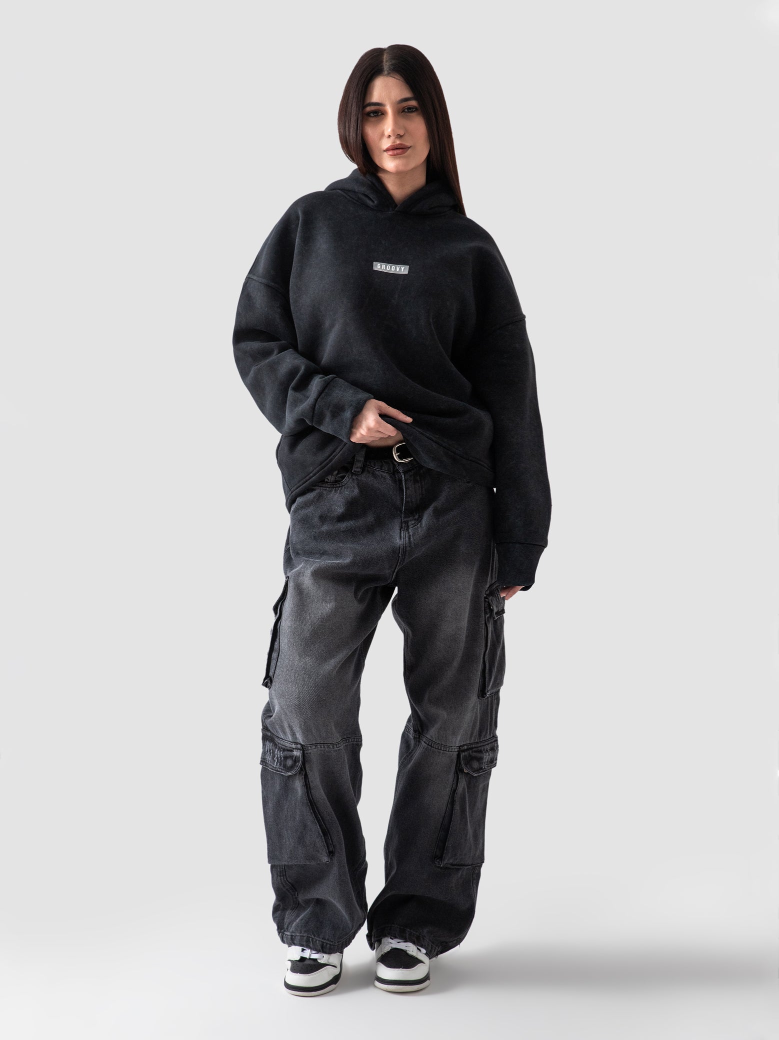 Washed black oversized hoodie couple lifestyle shot streetwear Pakistan – GROOVY