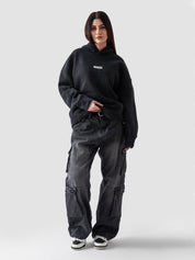 Washed black oversized hoodie couple lifestyle shot streetwear Pakistan – GROOVY