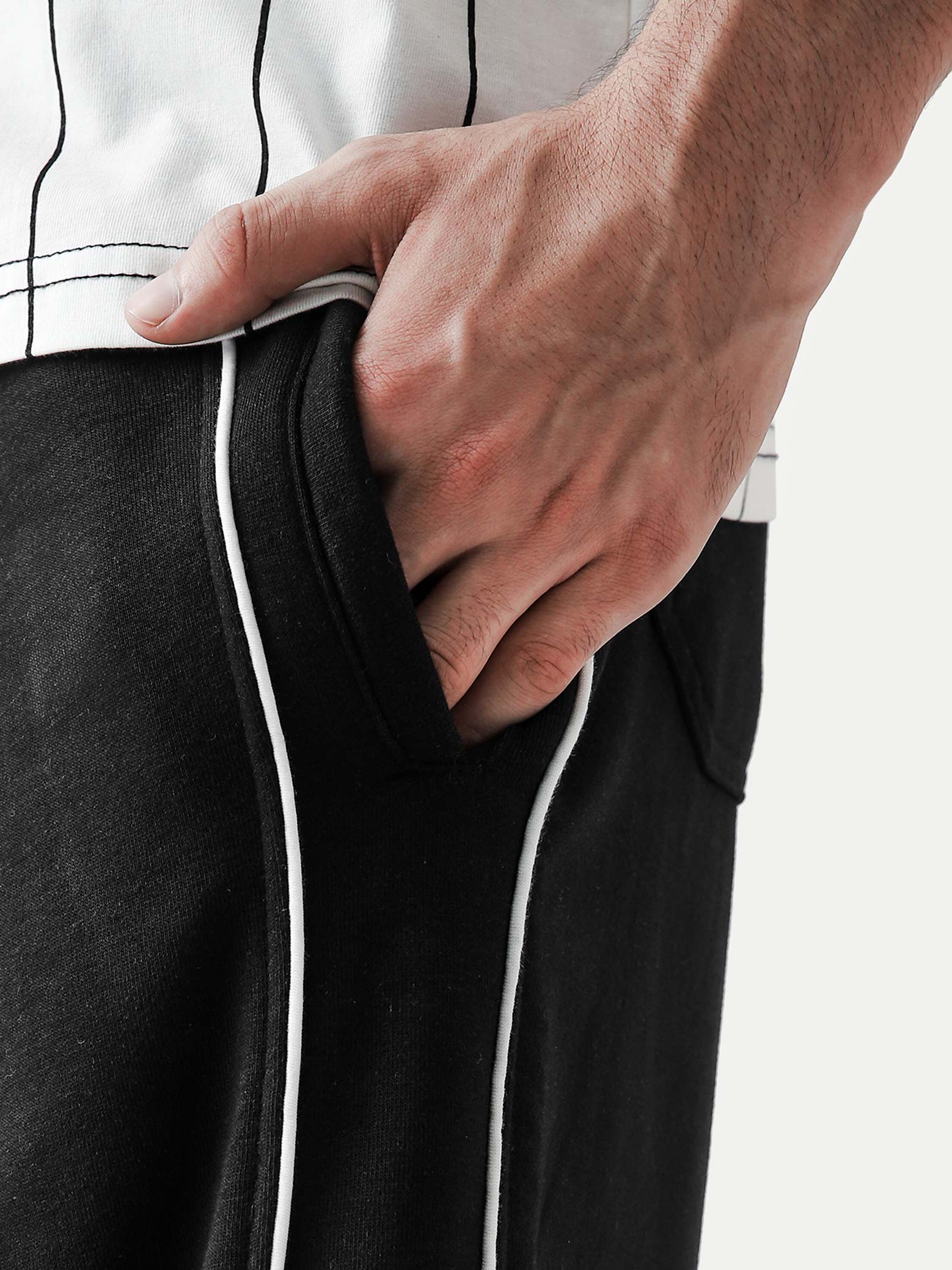 Black piping trouser male model side view full body streetwear Pakistan – GROOVY