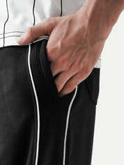 Black piping trouser male model side view full body streetwear Pakistan – GROOVY