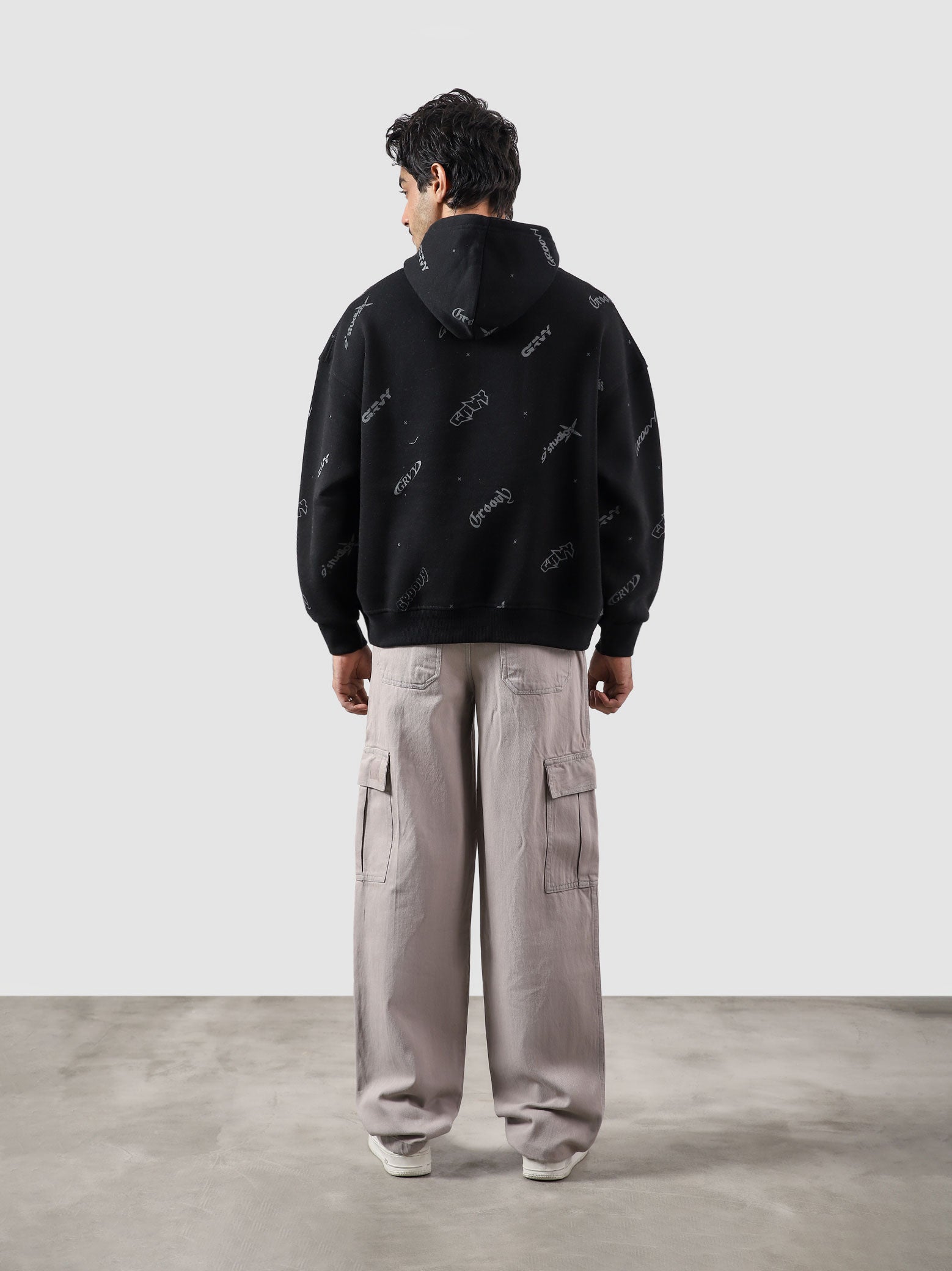 The Initial Hoodie male model side view oversized streetwear Pakistan – GROOVY