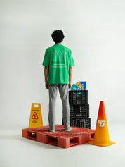 Emerald Green Tee Male Model Side View – Never Give Up – GROOVY Pakistan