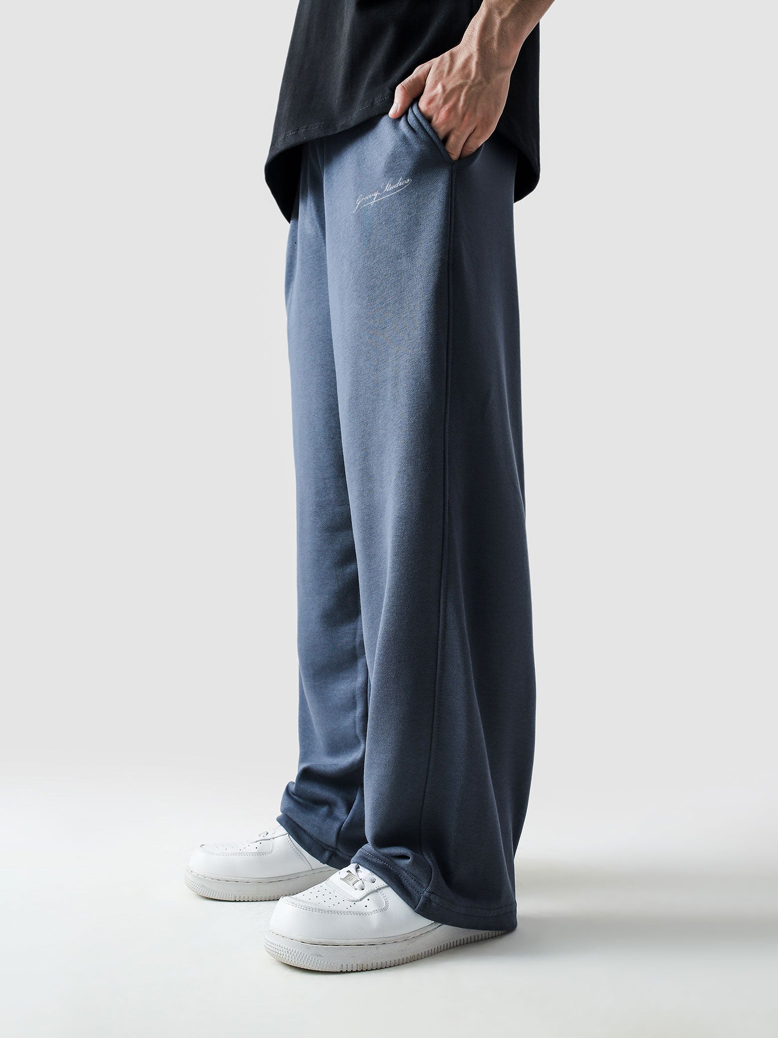 Slate blue baggy trousers male model side view full body streetwear Pakistan – GROOVY
