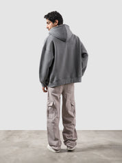 Dark heather grey essential zipper hoodie male model side view full body Pakistan – GROOVY